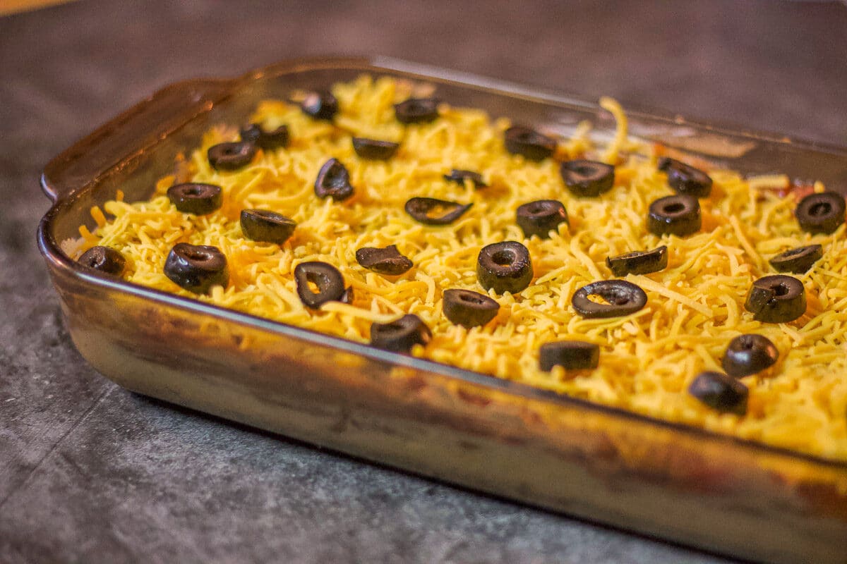 Mexican bean dip topped with sliced black olives