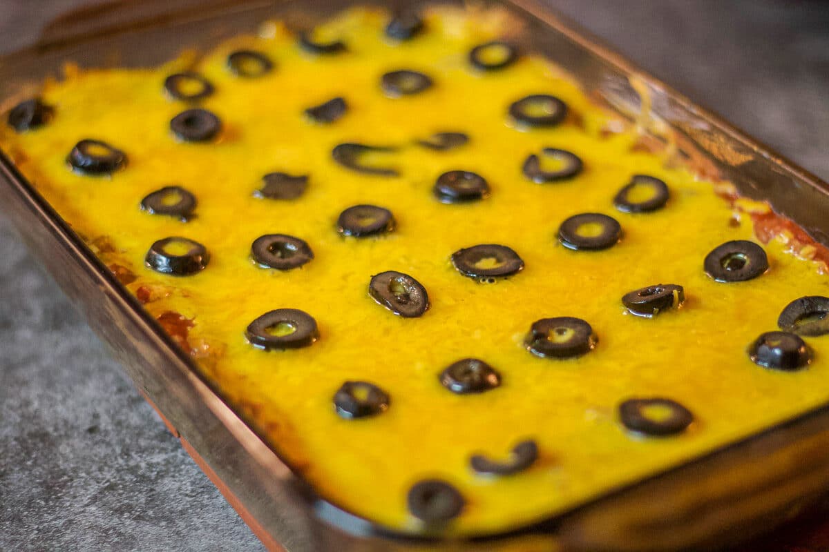 mexican bean dip in a rectangle baking dish