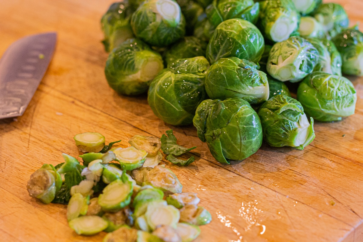 trimmed brussel sprouts on a cutting board