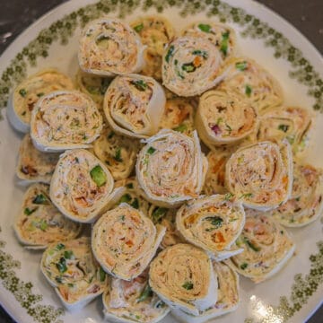 smoked salmon pinwheels on a white plate