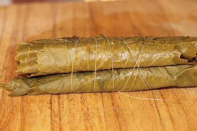 pickled grape leaves rolled and tied together