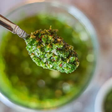 serving chimichurri sauce out of a jar
