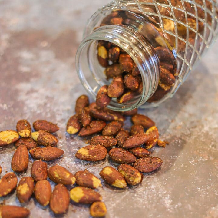 toasted almonds spilling from a jar