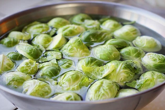 brussel sprouts soaking in water