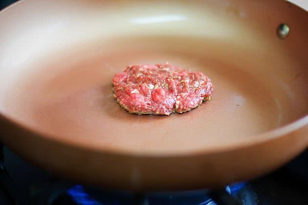 a sausage patty in a brown pan
