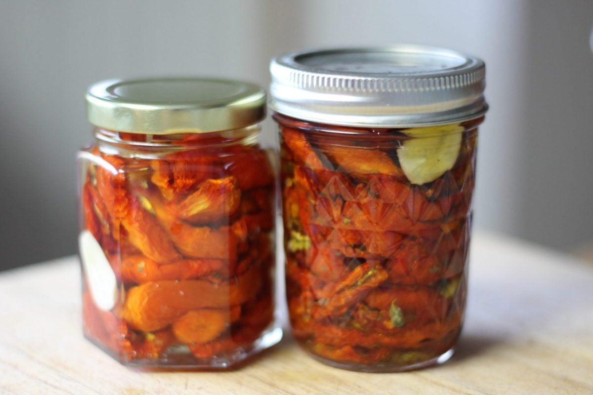 sun-dried tomatoes in 2 jars on the counter