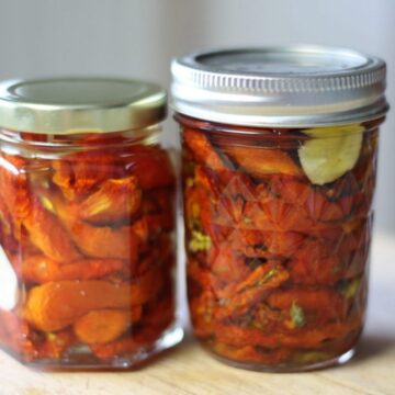 sun-dried tomatoes in 2 jars on the counter