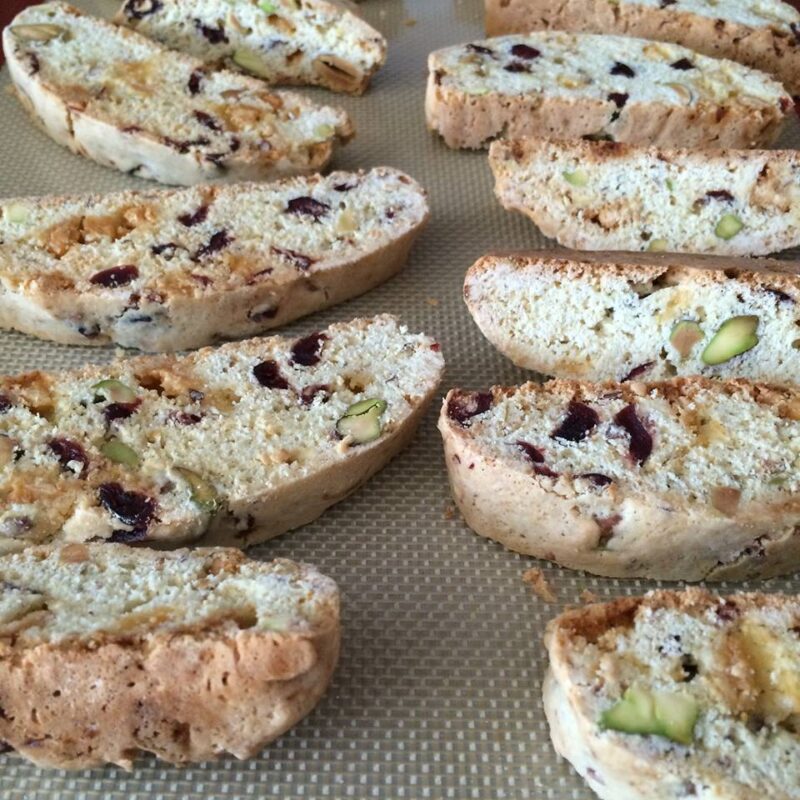 cranberry and pistachio biscotti on a cookie sheet