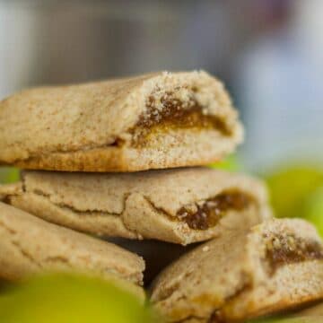 homemade fig newtons piled high with figs around them