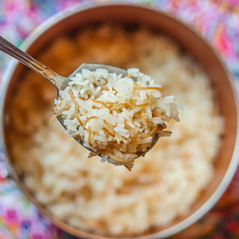 rice being spooned out of pot.