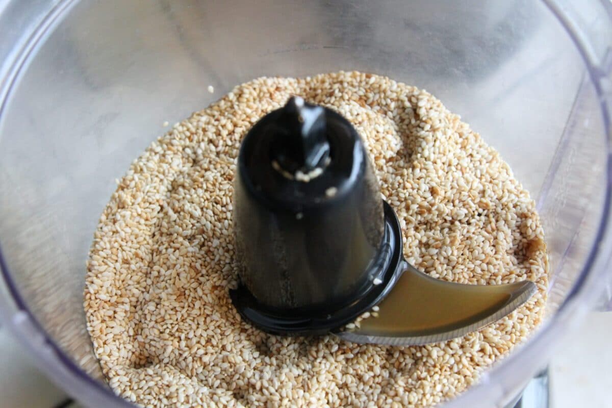 sesame seeds in a food processor for tahini paste