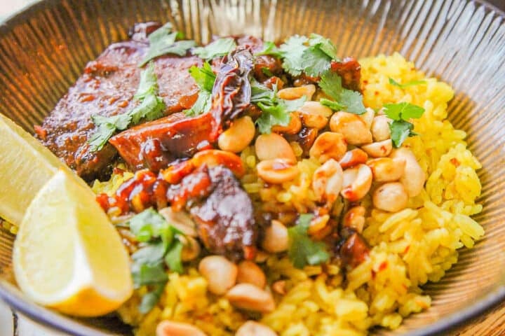 creamy coconut rice with peanuts, lime, and pork.