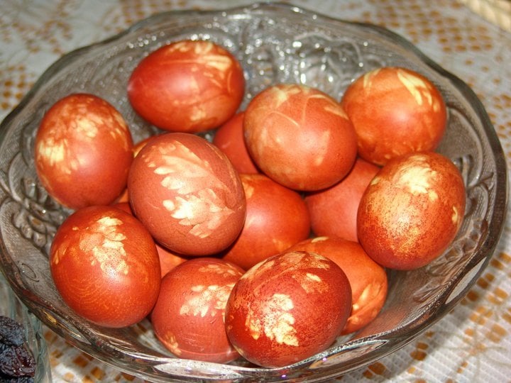 red Easter eggs in a glass dish