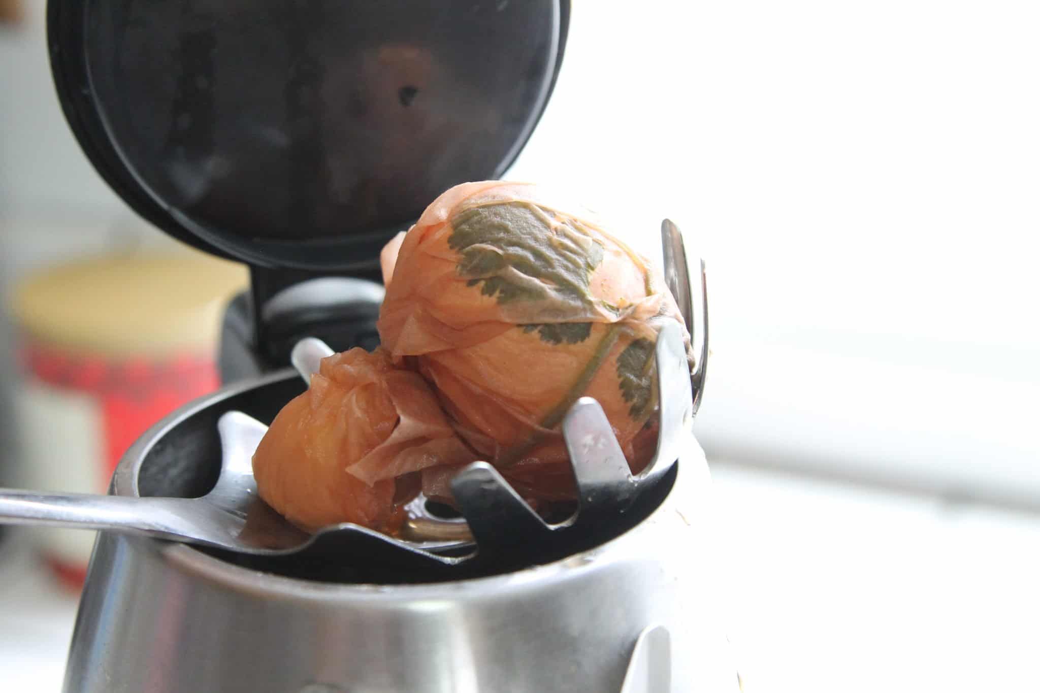 Easter eggs being removed from tea kettle