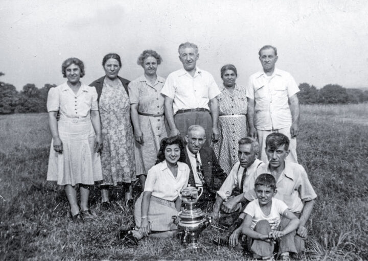 a family outdoors with a samovar