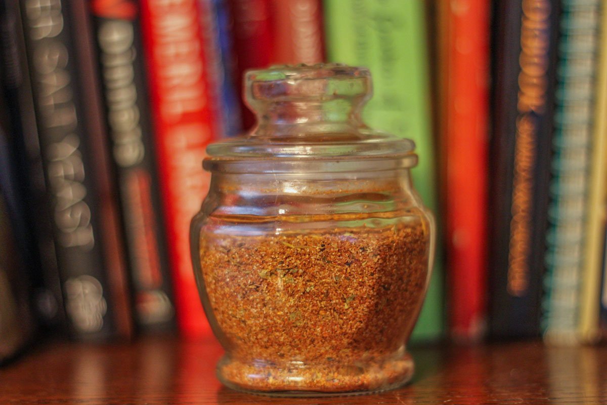 spices in a jar infant of a book shelf