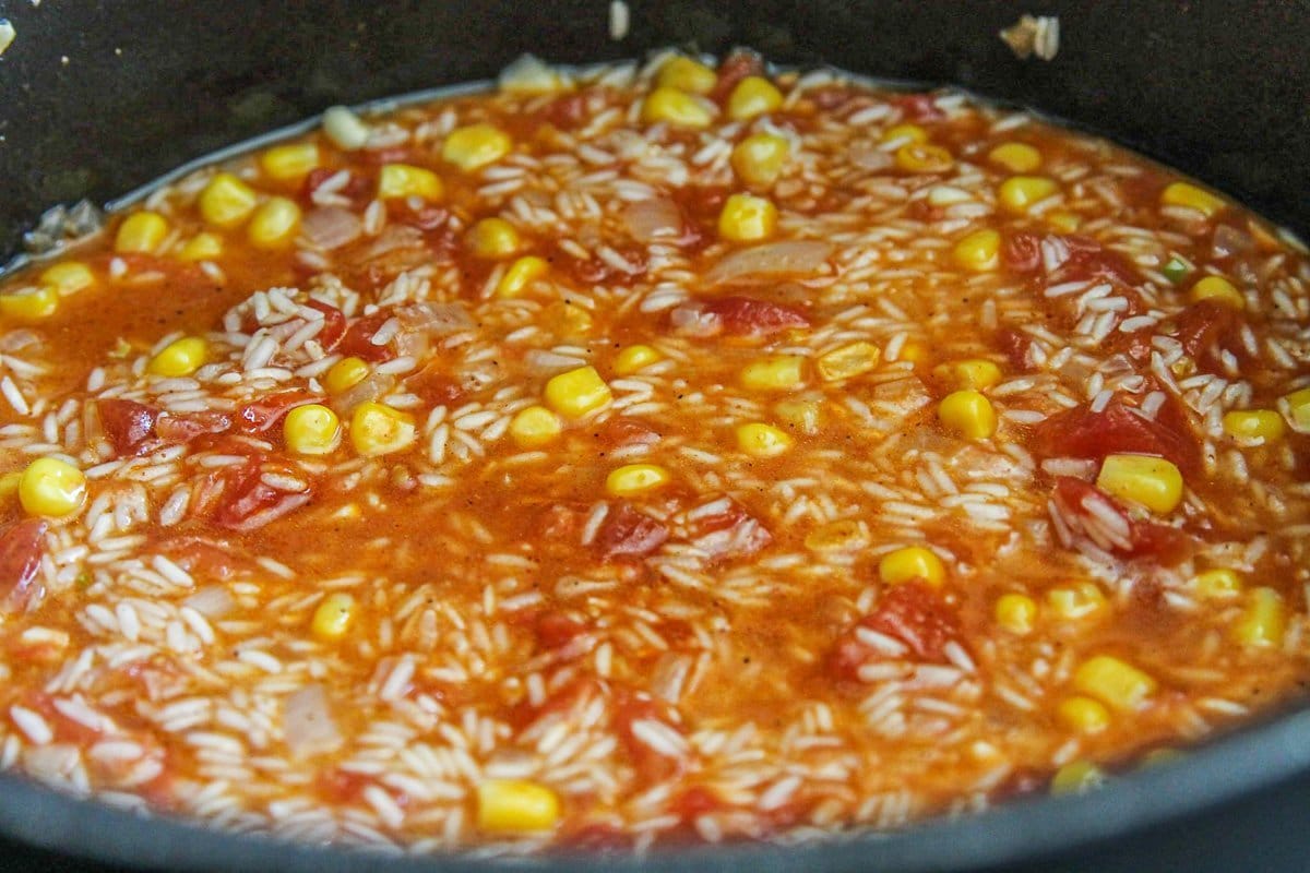 rice being cooked in a pot