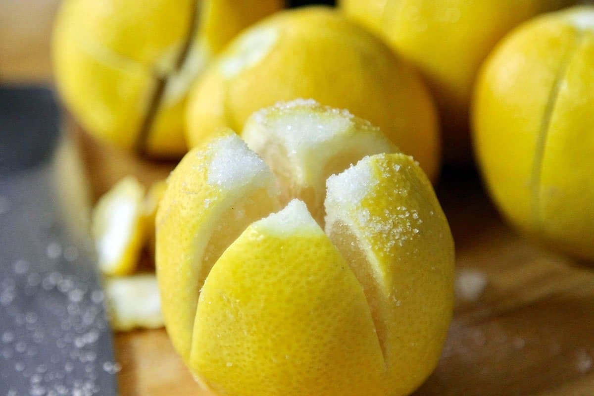 lemons slit down the middle with salt all over it