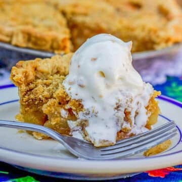 a slice of pear pie with a scoop of vanilla ice cream