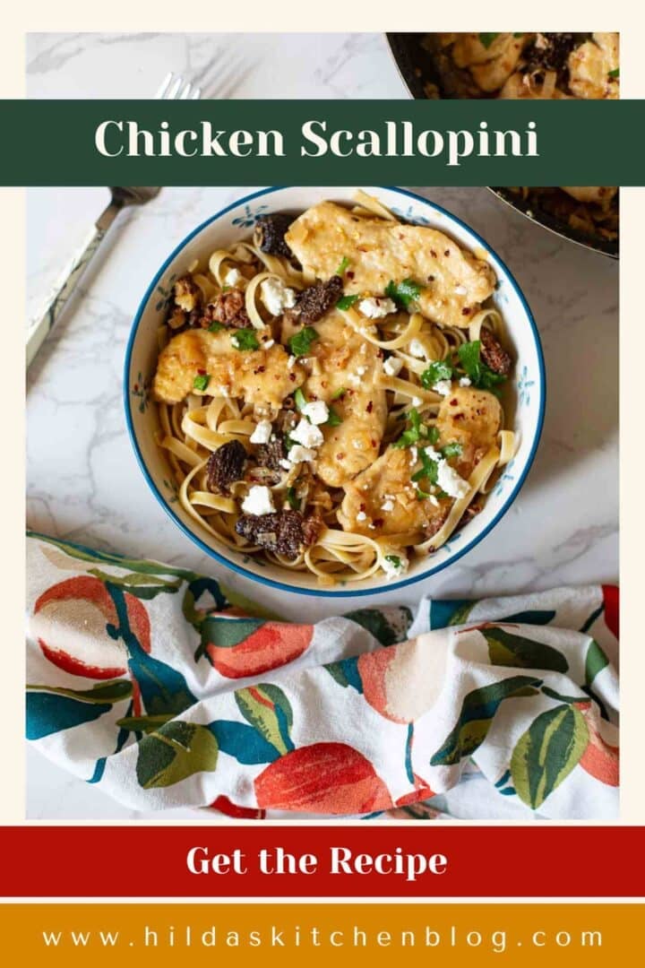 chicken scallopini in a bowl over pasta