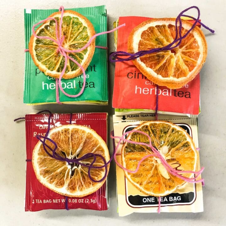 tea packets wrapped with orange slices