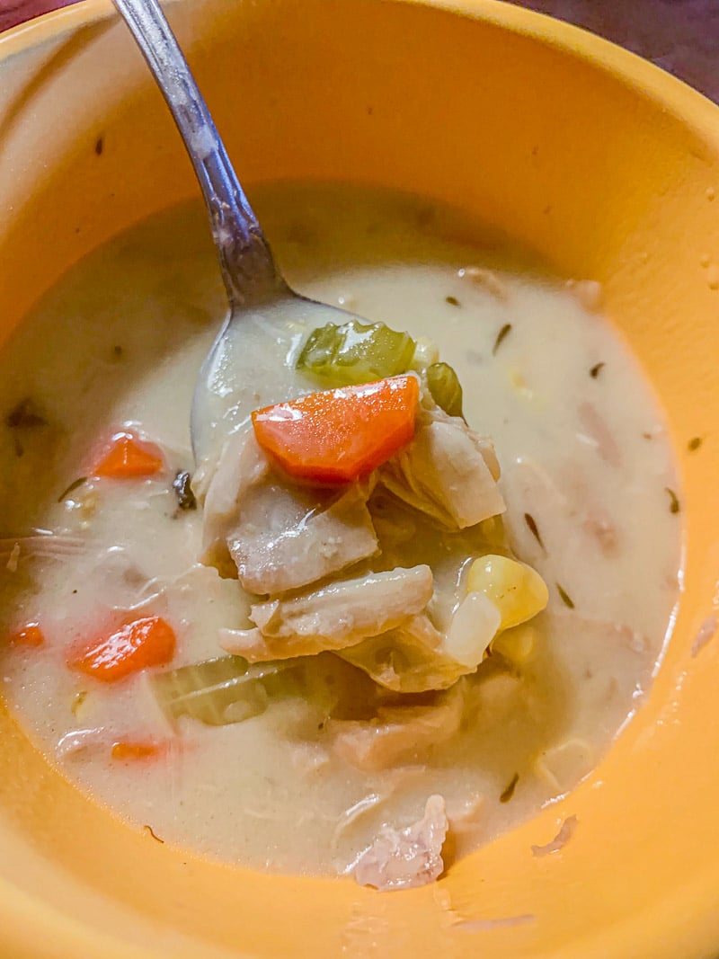 turkey soup in a yellow bowl
