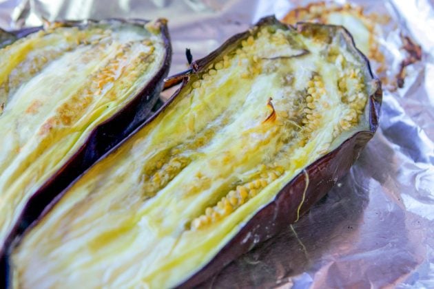 roasted eggplant on a foil-lined tray