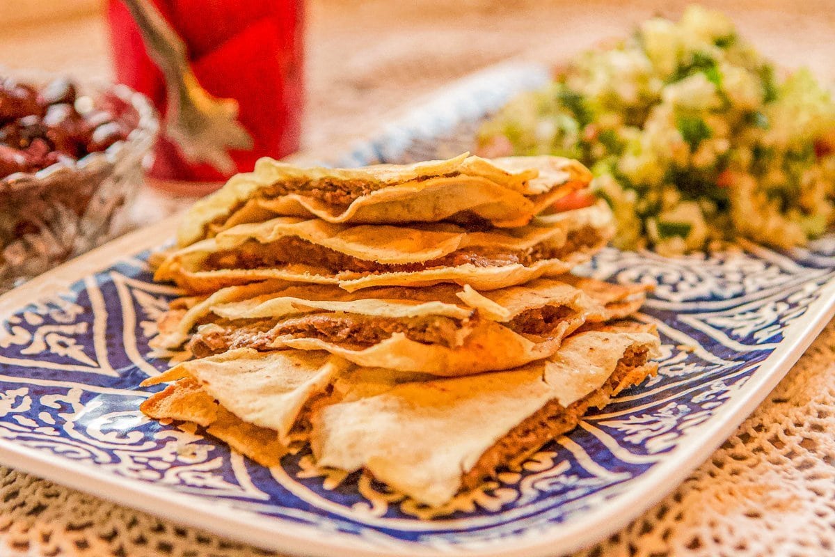 arayes on a blue plate with tabouli