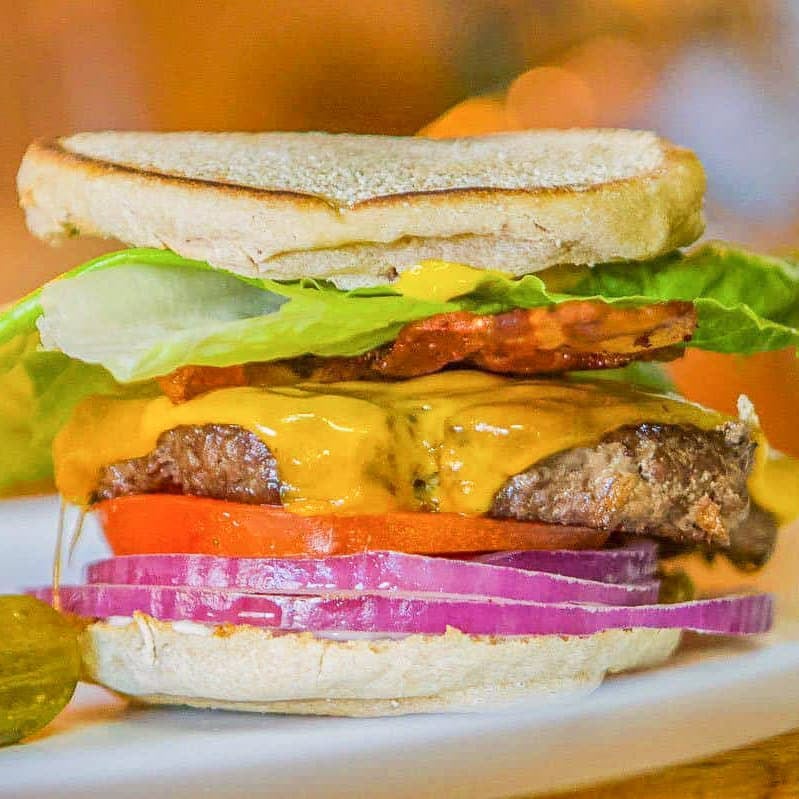 buffalo burger with onion, tomato, lettuce, and cheese.