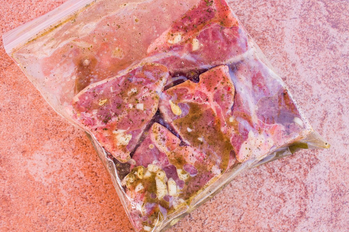 lamb loin chops in a plastic bag with marinade