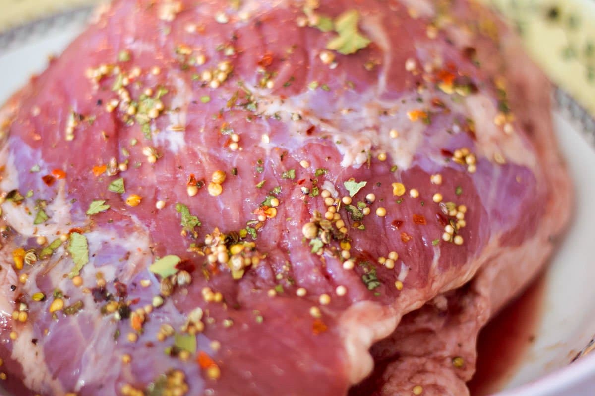 raw brisket covered with spices