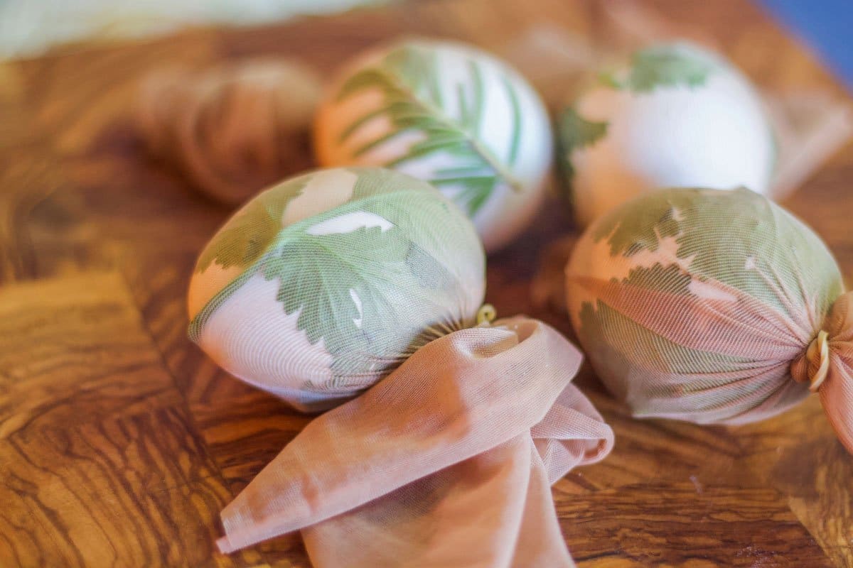 eggs covered with herbs and wrapped in nylons