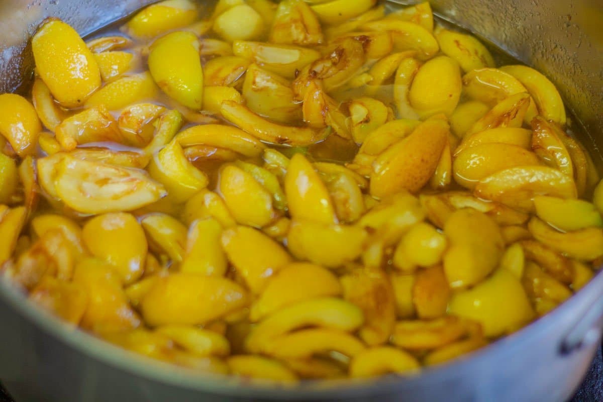 sliced loquats in a pot