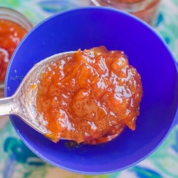 loquat jam being spooned into jars