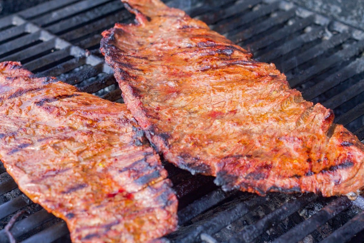 skirt steak carne asada being grilled