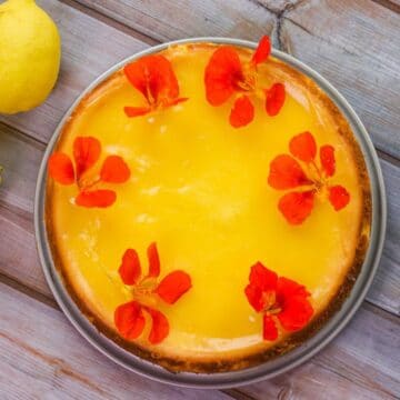 limoncello cheesecake with topped with nasturtium flowers