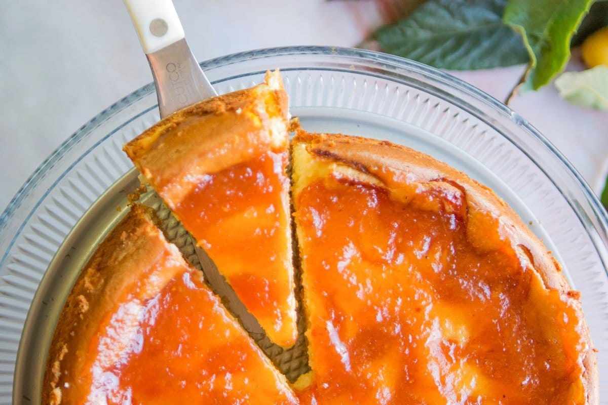 loquat cheesecake with a slice being served