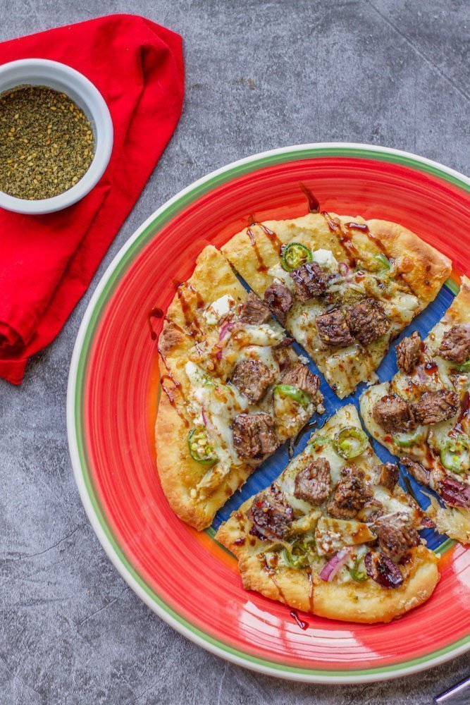 shawarma pizza with zaatar on the side