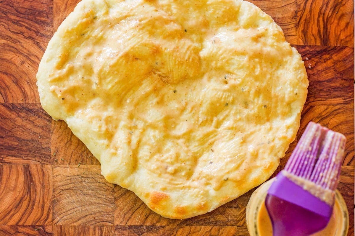 naan bread smeared with tahini sauce