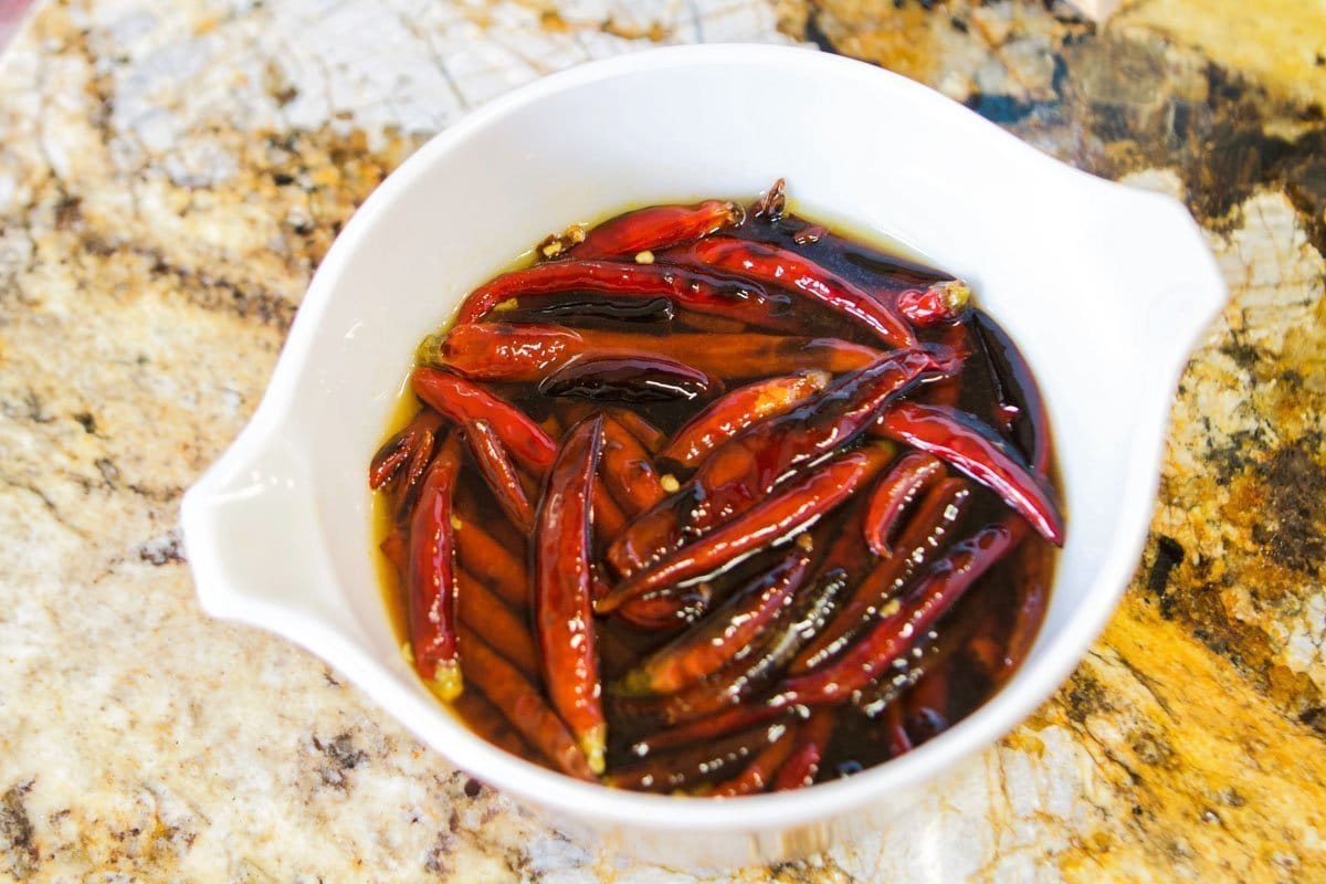 rehydrating arbol chiles in a bowl