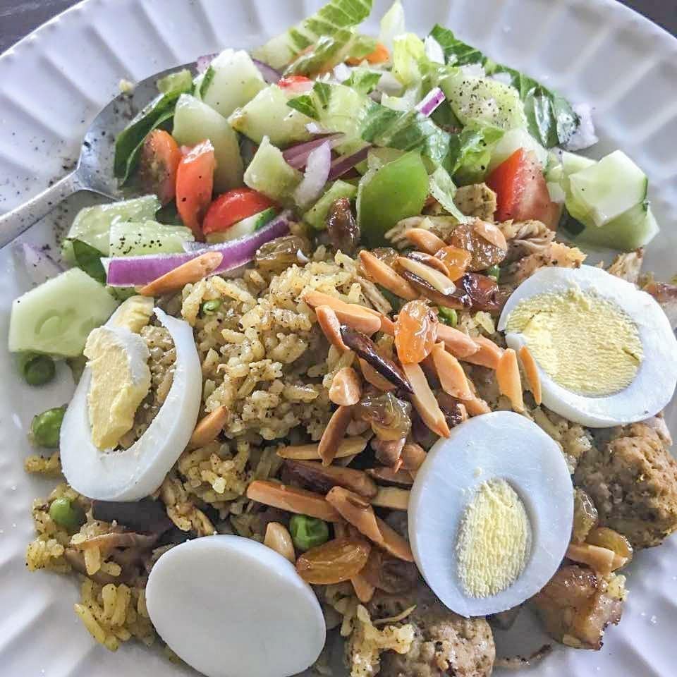 biryani with boiled eggs and salad