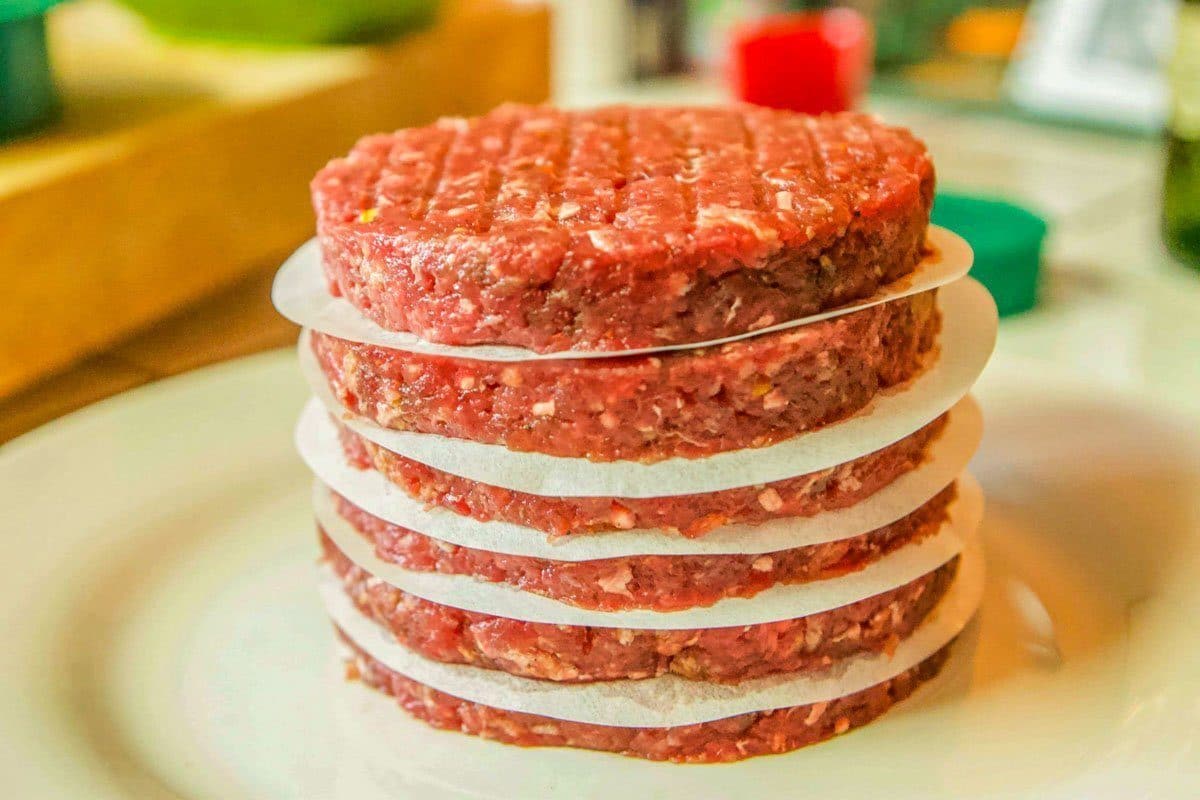 burgers stacked on plate