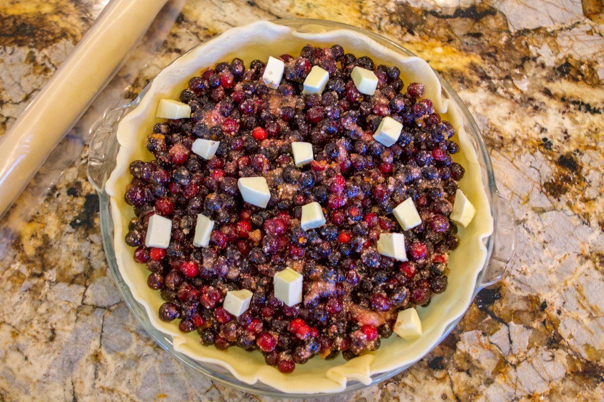 huckleberry pie dotted with butter