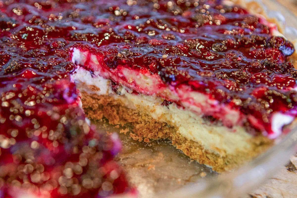 berry cheesecake with a slice missing