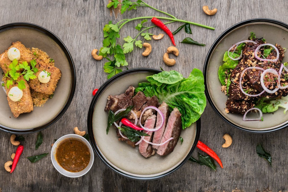 steak chicken and other food spread on the counter