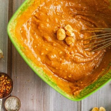 peanut dipping sauce in a bowl being whisked