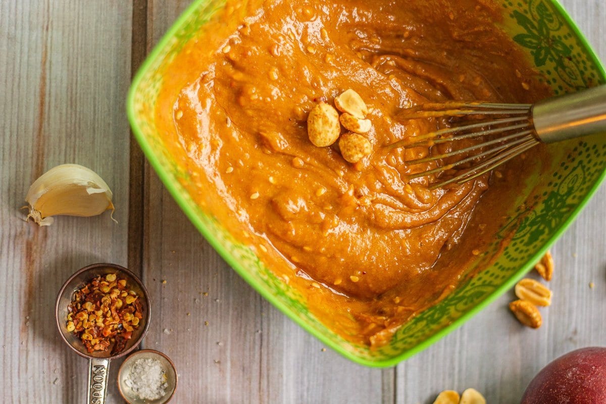 peanut dipping sauce in a bowl being whisked