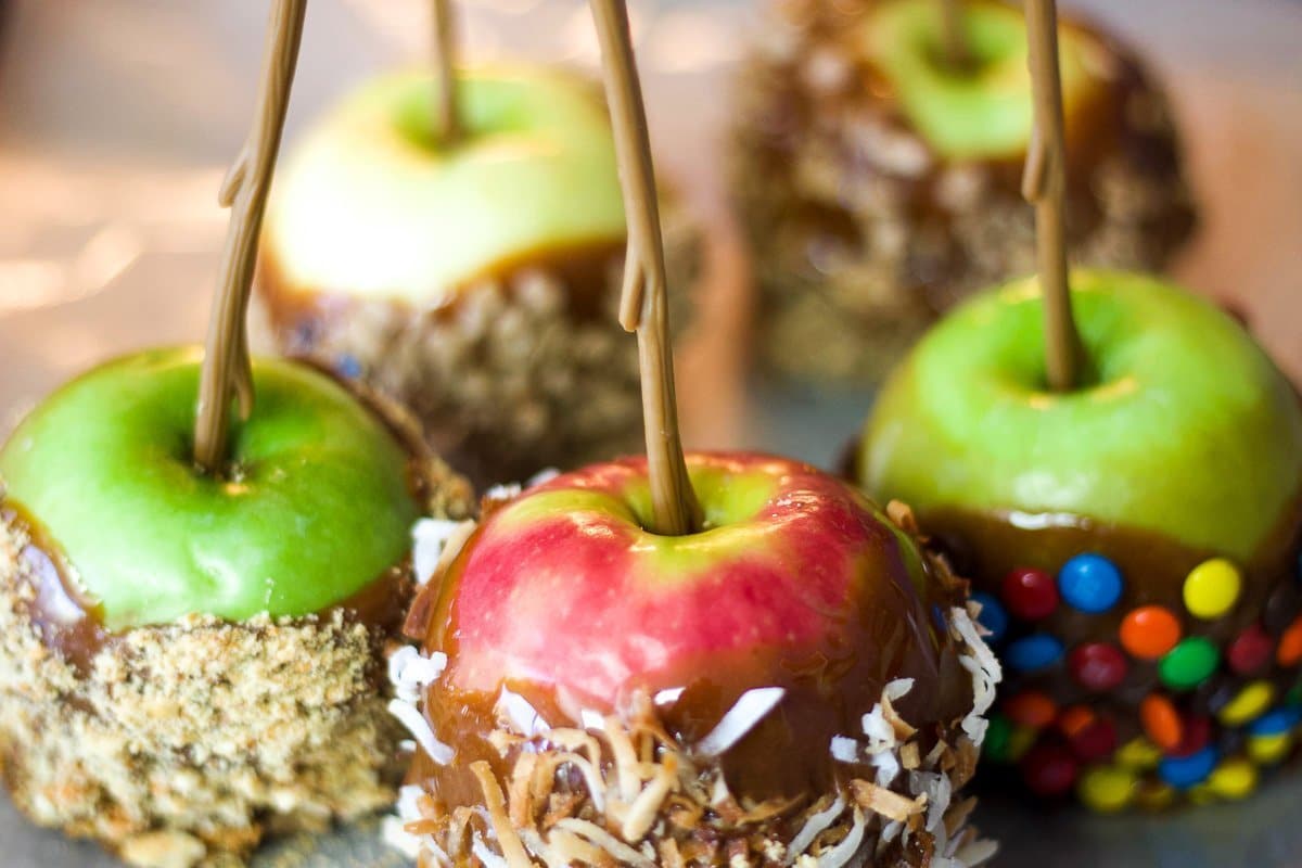 five various flavored caramel apples