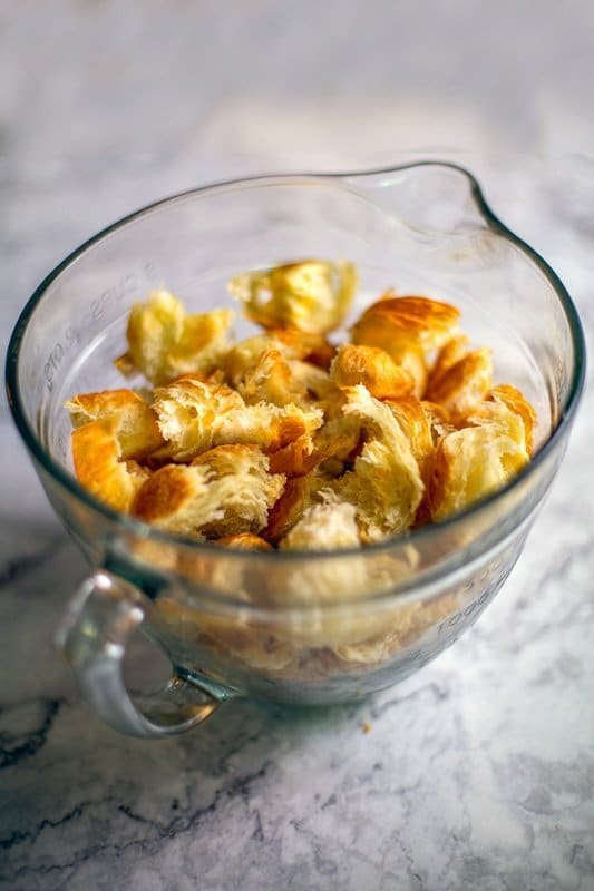 croissant chunks in measuring cup