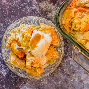 peach bread pudding topped with ice cream and sauce